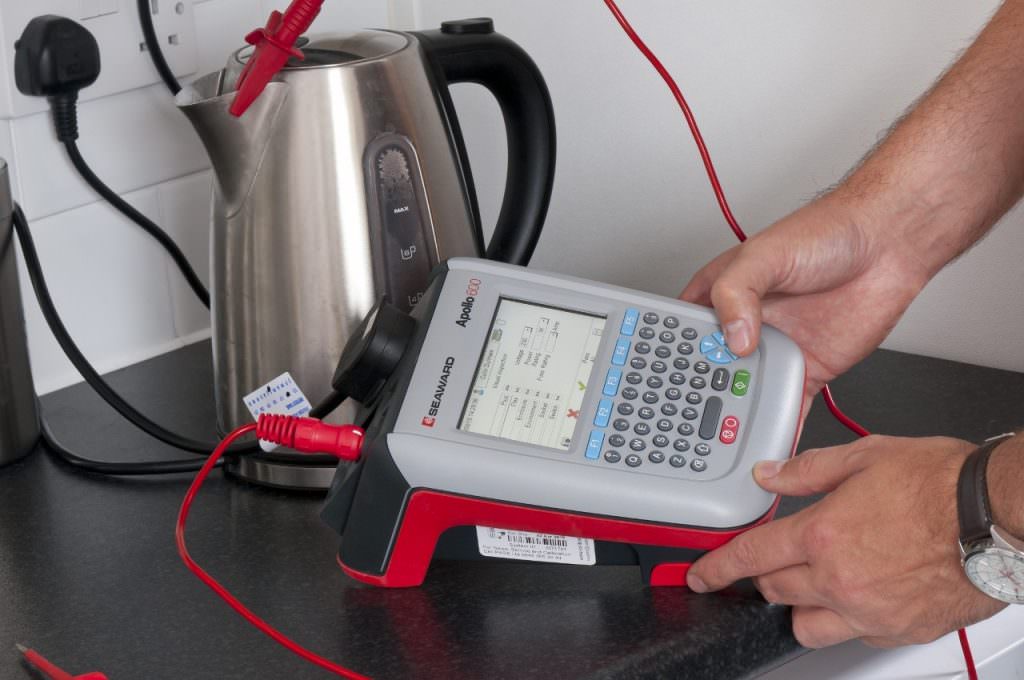 Seaward Apollo 600+ PAT tester connected to an electric kettle during electrical appliance safety testing.